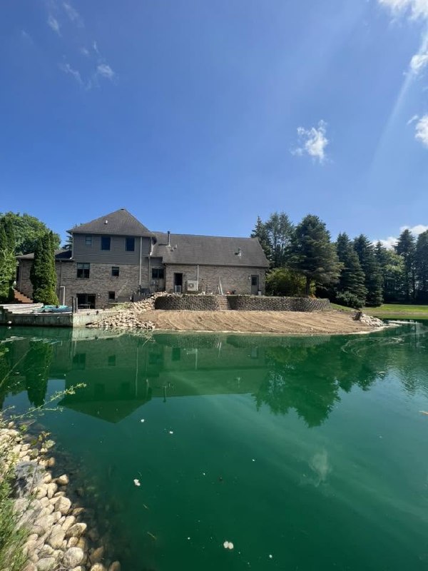 Finished pond and retaining wall work
